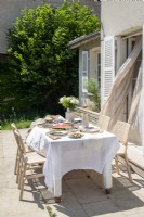 Outdoor dining table on terrace in summer