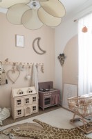 Childrens toys in modern bedroom decorated in muted tones 