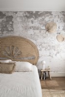 Modern country style bedroom with bare plaster wall