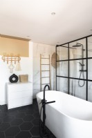 Freestanding bath and shower cubicle with crittall windows