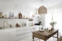 White country kitchen-diner with wooden table