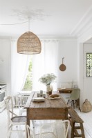 Wooden table in white country kitchen-diner