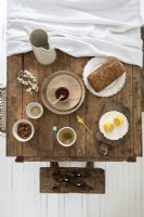 Overhead detail of food on rustic wooden dining table