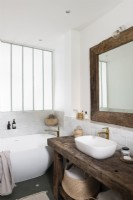 Wooden furnishings in white country style bathroom