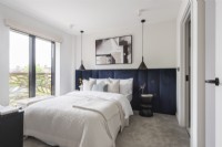 Modern bedroom with padded headboard