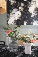 Flower arrangement detail on black marble dining table