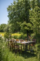 Outdoor dining table in country garden