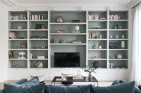 Full wall shelving unit in modern living room