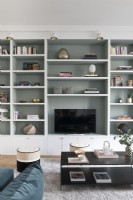 Built-in shelving unit and television in modern living room