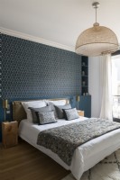 Modern classic style bedroom with blue and gold feature wall