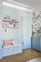Built-in bench seat with storage in modern childrens bedroom