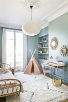 Pink tepee play tent in blue painted childs bedroom