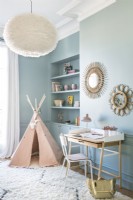 Pink tepee play tent in blue painted childrens room