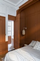 Brown and white painted bedroom with period details