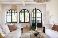 Large arched windows and doors in modern living room