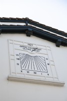 Black and white date plaque on exterior of country villa