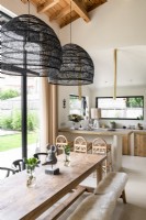 Modern country kitchen diner with large wooden table