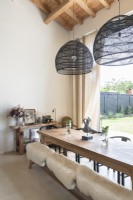 Sheepskins covering bench seat around dining room table