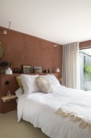 Modern bedroom with brown fabric wall