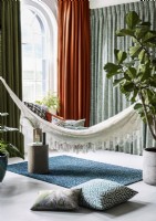Hammock in contemporary living room with curtains