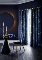 Dark blue contemporary dining room with curtains