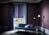 Dark purple room with curtain and roman blind