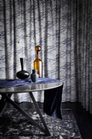Contemporary objects on table with curtain background