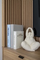 Small sculptures standing on a shelf