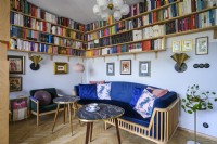 Living room with a blue sofa and a collection of books