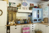 Country kitchen with a blue reclaimed cupboard