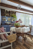 Dining rooms with a round table and a blue sideboard