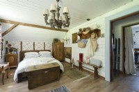 Bed in a country bedroom in the attic
