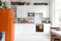 Contemporary White Kitchen with orange accents