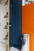 Internal door painted orange and blue