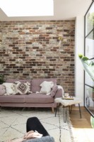Open plan extension with exposed brick wall and crittal doors