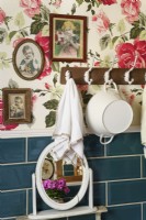 Rose patterned wallpaper in country bathroom