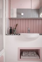 Contemporary bathroom with pink details.