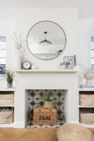 Tiled fireplace in a modern living room with built in shelving