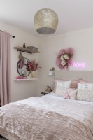 Teenage girl's bedroom with panelled wall


