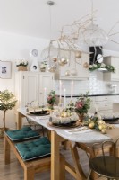 Dining table set for Christmas in an open plan kitchen diner
