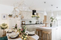 Dining table set for Christmas in an open plan kitchen diner