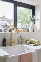 Butlers sink with gold taps and Christmas accessories
