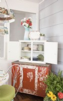 Vintage sideboard in dining area of 3-season porch makeover