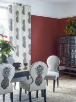 Pineapple inspired room furnishings with red wall