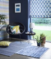 Modern room with blue patterned Roman blind