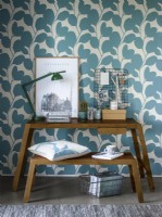 Home office with patterned wallpaper