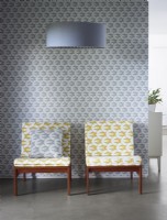 Yellow patterned chairs with grey matching patterned wallpaper