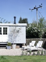 Guest room shepherds hut with outside loungers 