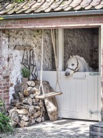White horse in stable