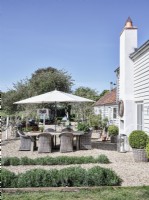 Exterior of country house with outdoor dining area